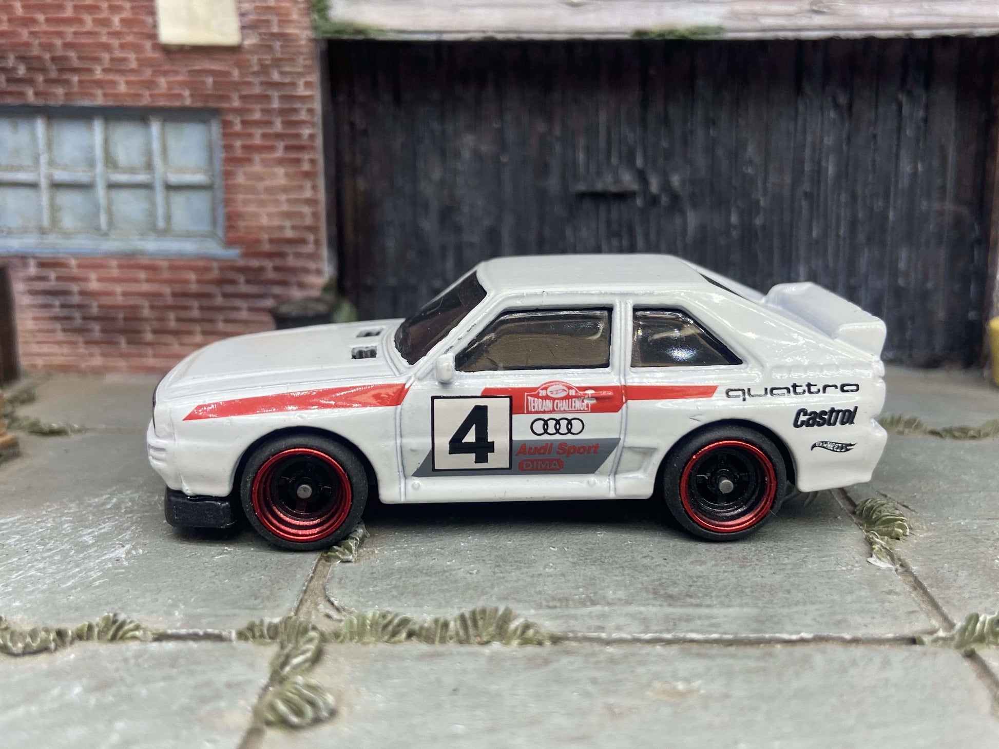 Custom Hot Wheels 1984 Audi Sport Quatro In White Red and Green Livery With Black and Red 4 Spoke Race Wheels With Rubber Tires