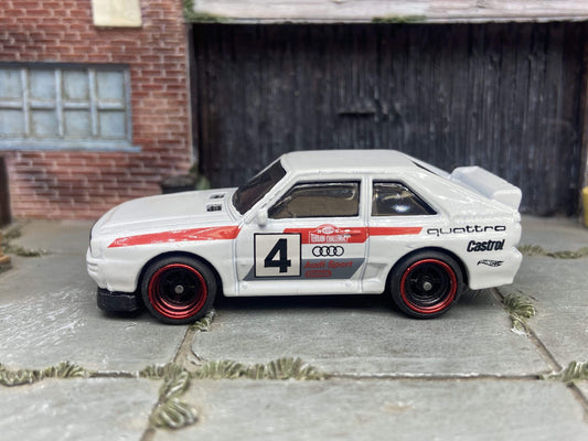 Custom Hot Wheels 1984 Audi Sport Quatro In White Red and Green Livery With Black and Red 4 Spoke Race Wheels With Rubber Tires