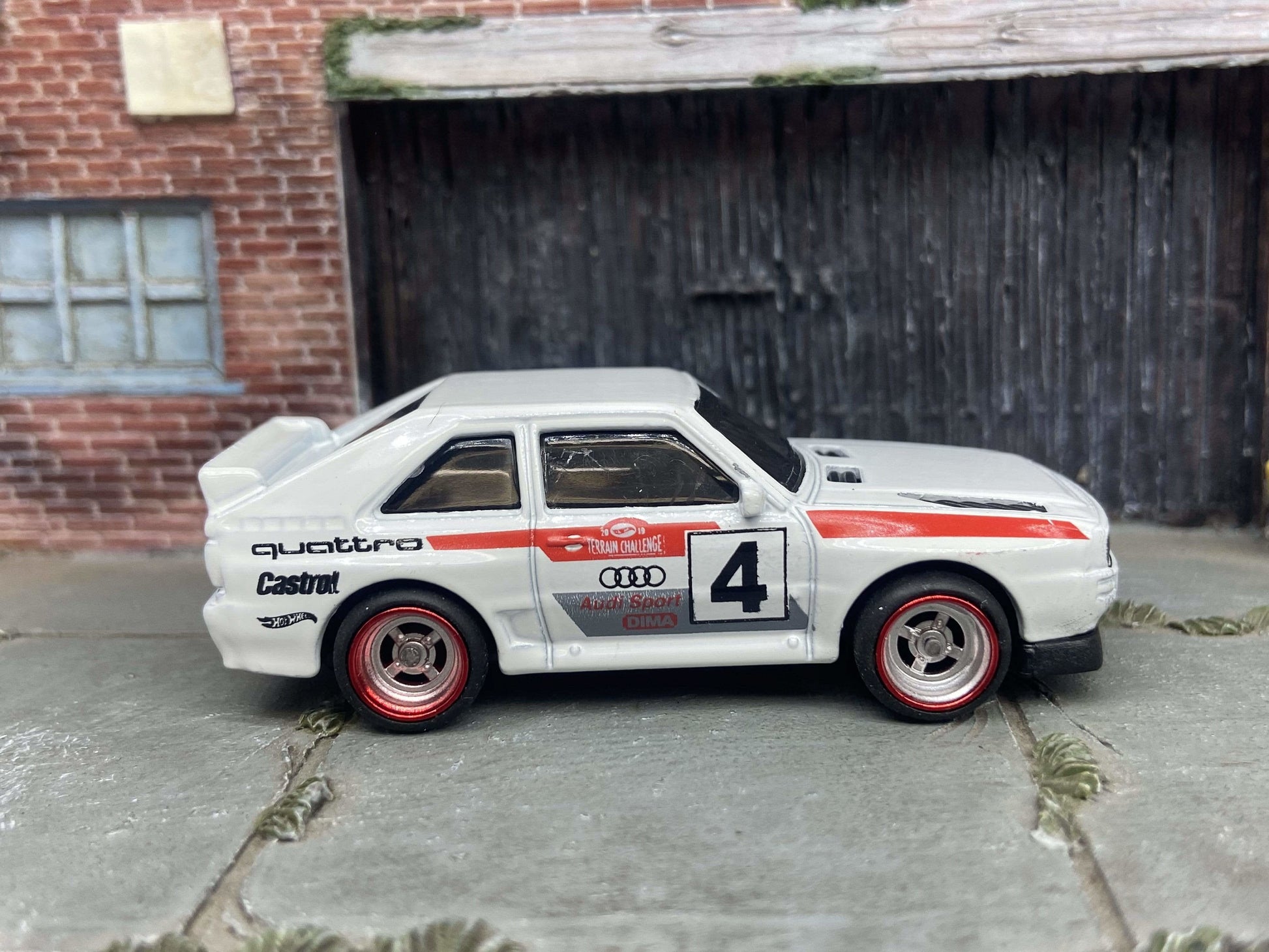 Custom Hot Wheels 1984 Audi Sport Quatro In White Red and Green Livery With Chrome and Red 4 Spoke Race Wheels With Rubber Tires