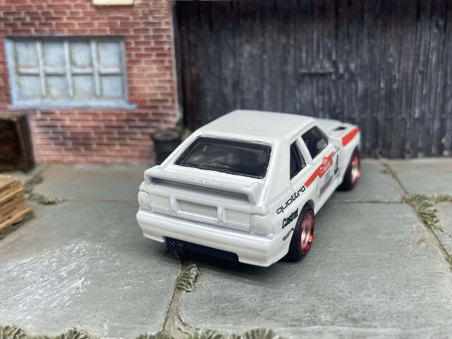 Custom Hot Wheels 1984 Audi Sport Quatro In White Red and Green Livery With Chrome and Red 4 Spoke Race Wheels With Rubber Tires