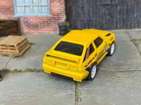 Custom Hot Wheels 1984 Audi Sport Quattro in yellow with white mag wheels and rubber tires