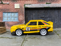 Custom Hot Wheels 1984 Audi Sport Quattro in yellow with white mag wheels and rubber tires