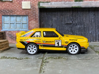 Custom Hot Wheels 1984 Audi Sport Quattro in yellow with white mag wheels and rubber tires