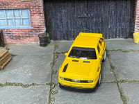 Custom Hot Wheels 1984 Audi Sport Quattro in yellow with white mag wheels and rubber tires