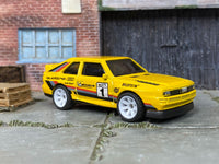 Custom Hot Wheels 1984 Audi Sport Quattro in yellow with white mag wheels and rubber tires