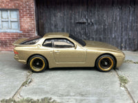 Gold 1989 Porsche 944 Turbo custom Hot Wheels with black and gold wheels, view 3