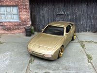 Gold 1989 Porsche 944 Turbo custom Hot Wheels with black and gold wheels, view 4