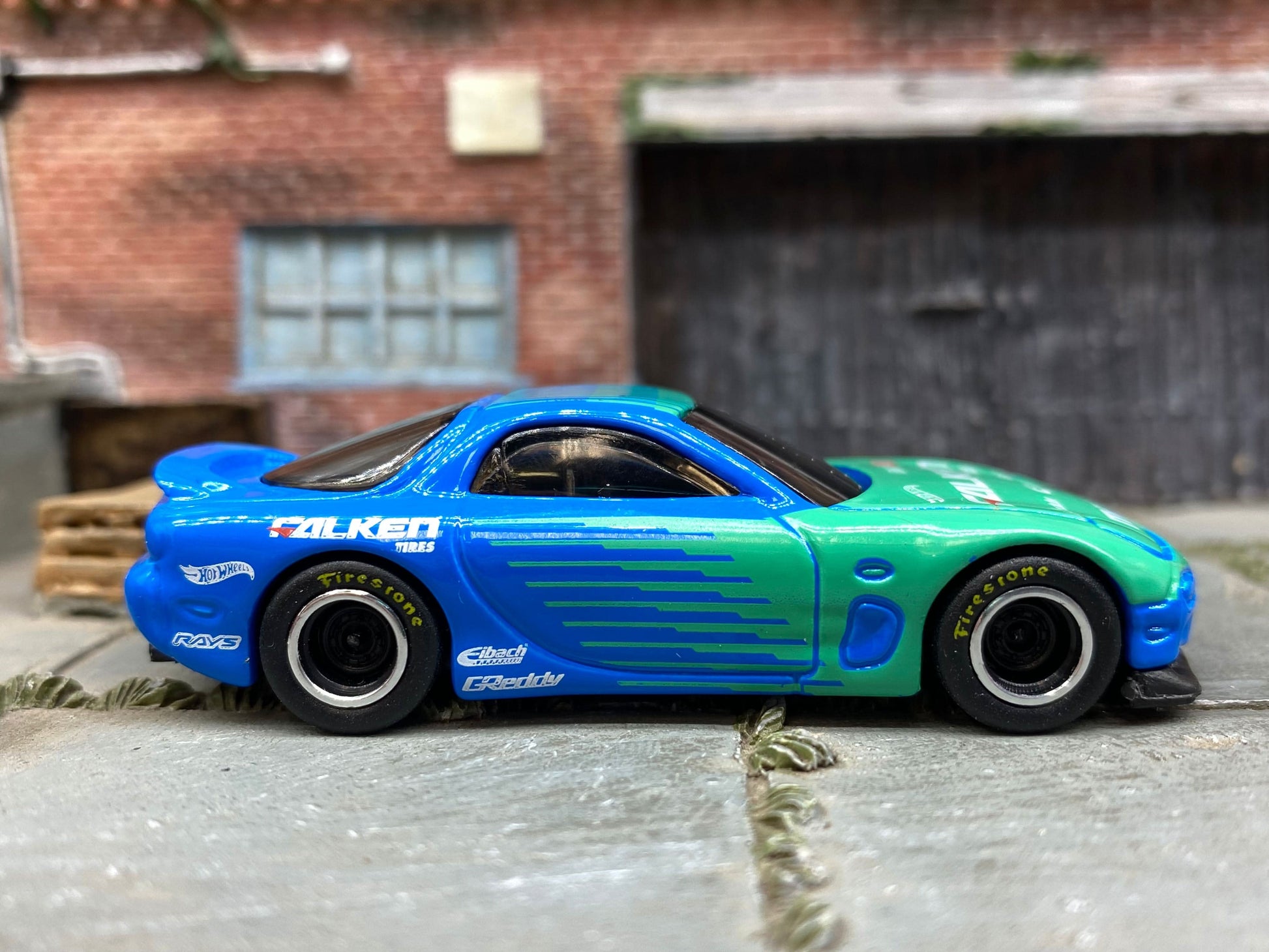 Custom Hot Wheels 1995 Mazda RX7 In Blue and Green  Falken Tires With Black and Chrome Steel Wheels With Firestone Tires