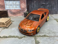 Burnt-orange 2006 Pontiac GTO custom Hot Wheels with gold wheels, view 4