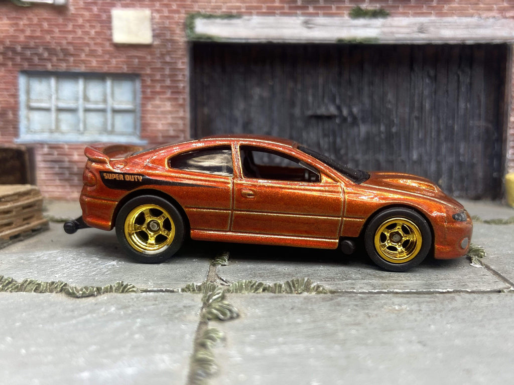 Custom Hot Wheels 2006 Pontiac GTO in Burnt Orange With Gold 5 Spoke Racing Wheels With Rubber Tires