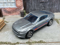 Side view of gray 2015 Mustang GT custom Hot Wheels with smoked-chrome wheels