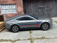Rear three-quarter view of gray Mustang GT custom Hot Wheels with rubber tires