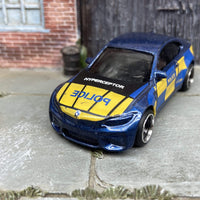 Custom Hot Wheels 2016 BMW M2 In Police Blue and Yellow Livery With Black and Chrome 4 Spoke Wheels With Rubber Tires