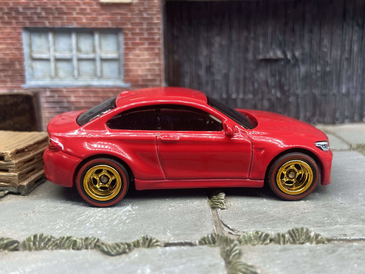 Front three-quarter view of red 2016 BMW M2 custom Hot Wheels