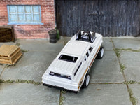 Custom Hot Wheels Cruise Bruiser in white and gold with white race wheels and rubber tires