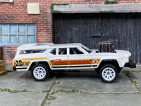 Custom Hot Wheels Cruise Bruiser in white and gold with white race wheels and rubber tires