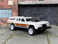 Custom Hot Wheels Cruise Bruiser in white and gold with white race wheels and rubber tires