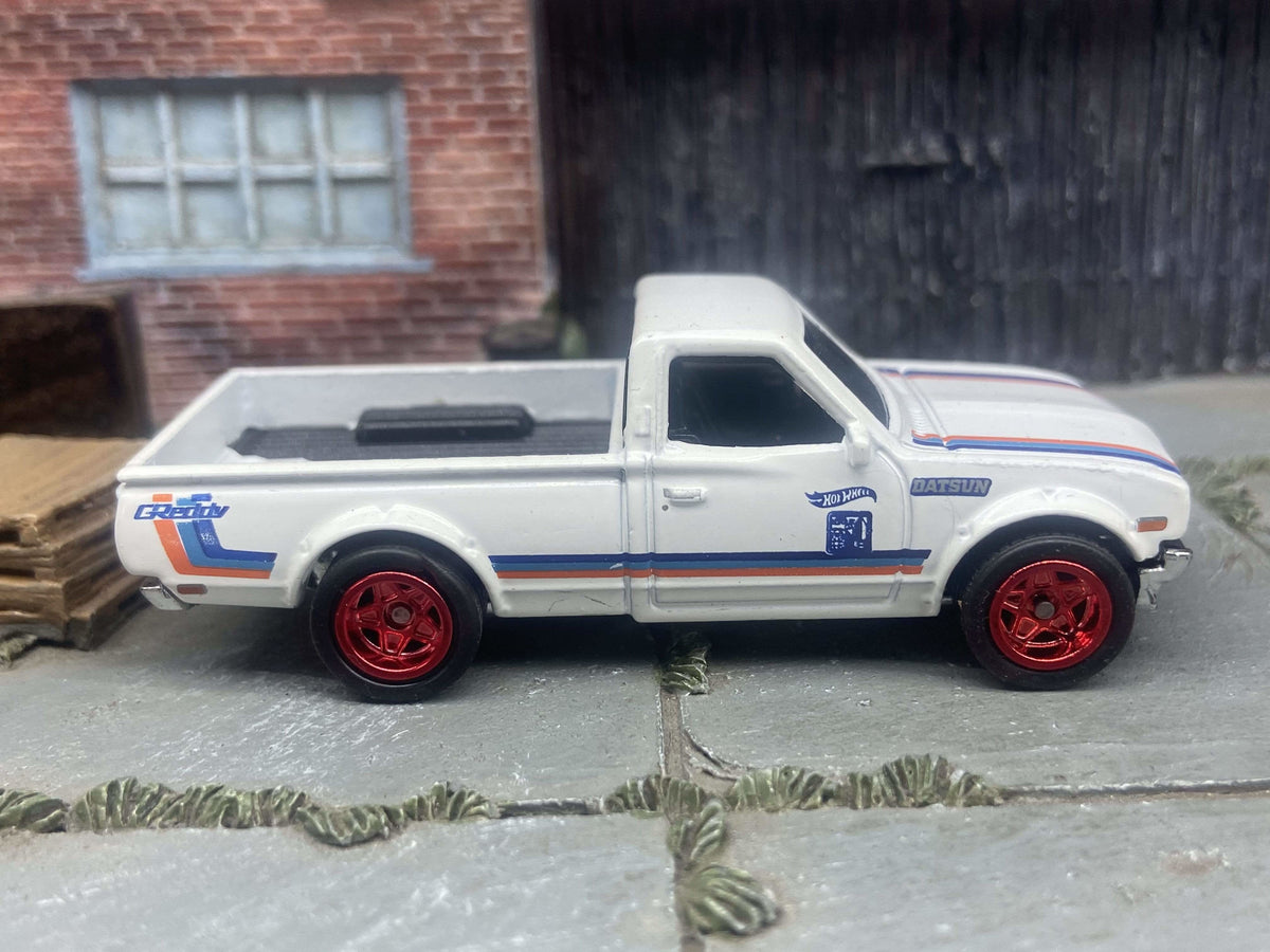 Front three-quarter view of white-and-red Datsun 620 custom Hot Wheels