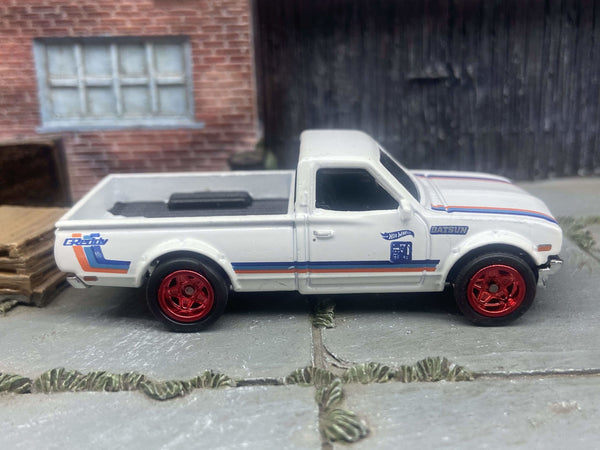 Front three-quarter view of white-and-red Datsun 620 custom Hot Wheels