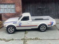 Rear three-quarter view of Datsun 620 mini truck with rubber tires