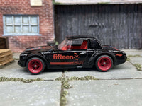 Black Fairlady 2000 custom Hot Wheels with red 4-spoke wheels — view 3