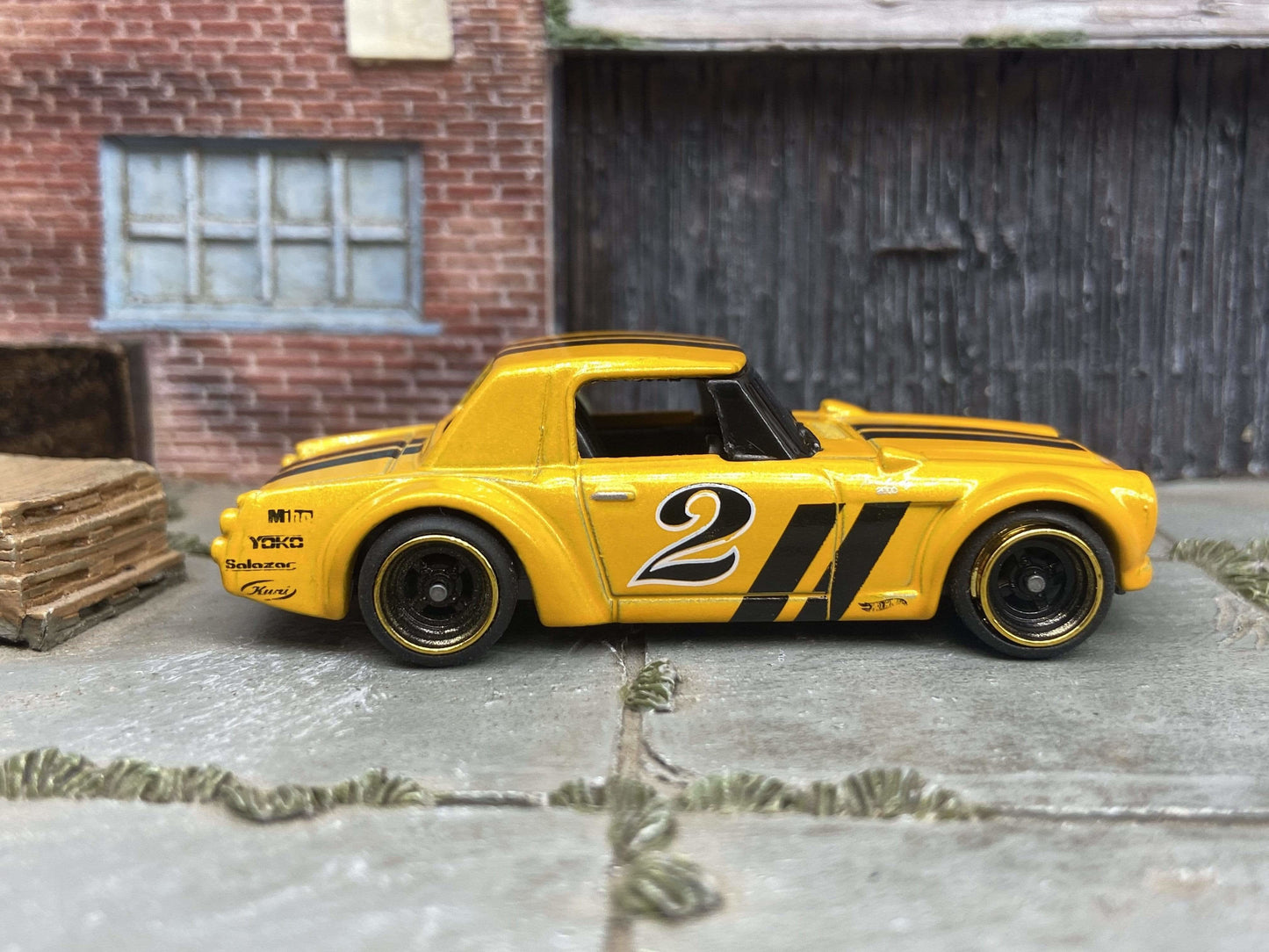Custom Hot Wheels Fairlady 2000 In Orange and Black With Black and Gold 4 Spoke Race Wheels With Rubber Tires