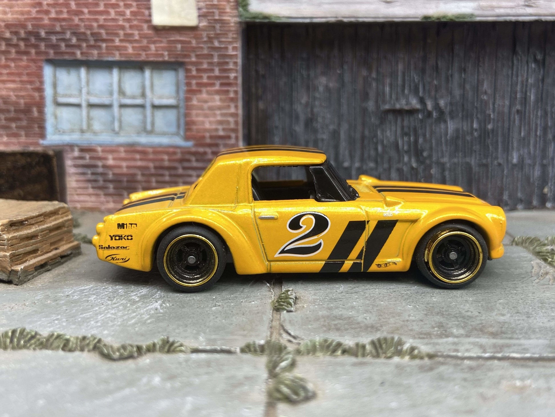 Custom Hot Wheels Fairlady 2000 In Orange and Black With Black and Gold 4 Spoke Race Wheels With Rubber Tires