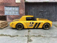 Orange and black Fairlady 2000 custom Hot Wheels with gold wheels, view 1