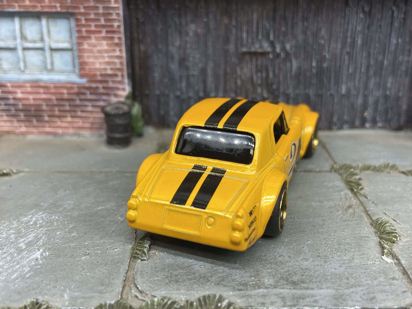 Custom Hot Wheels Fairlady 2000 In Orange and Black With Black and Gold 4 Spoke Race Wheels With Rubber Tires