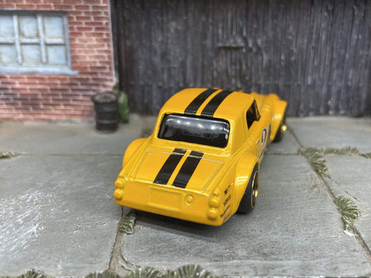 Custom Hot Wheels Fairlady 2000 In Orange and Black With Black and Gold 4 Spoke Race Wheels With Rubber Tires