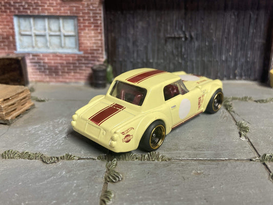 Custom Hot Wheels Fairlady 2000 In Yellow and Red With Black and Gold Race Wheels With Rubber Tires