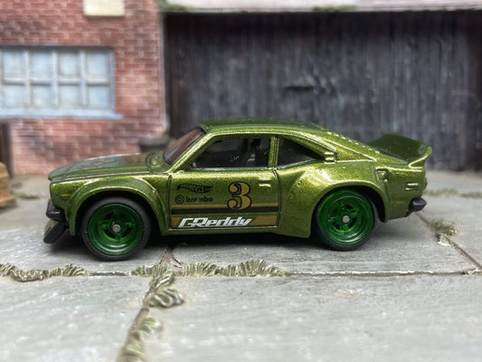 Custom Hot Wheels Mazda RX-3 In Green With Green 4 Spoke Race Wheels With Rubber Tires
