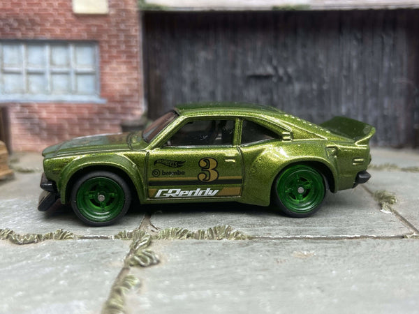 Green Mazda RX-3 custom Hot Wheels with green race wheels, view 1
