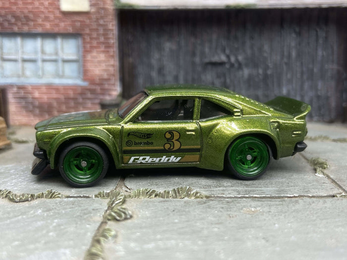 Green Mazda RX-3 custom Hot Wheels with green race wheels, view 1