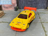 Custom Hot Wheels Pikes Peak Toyota Celica in Pennzoil Yellow with yellow race wheels and rubber tires