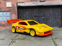 Custom Hot Wheels Pikes Peak Toyota Celica in Pennzoil Yellow with yellow race wheels and rubber tires