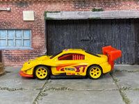 Custom Hot Wheels Pikes Peak Toyota Celica in Pennzoil Yellow with yellow race wheels and rubber tires
