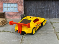 Custom Hot Wheels Pikes Peak Toyota Celica in Pennzoil Yellow with yellow race wheels and rubber tires