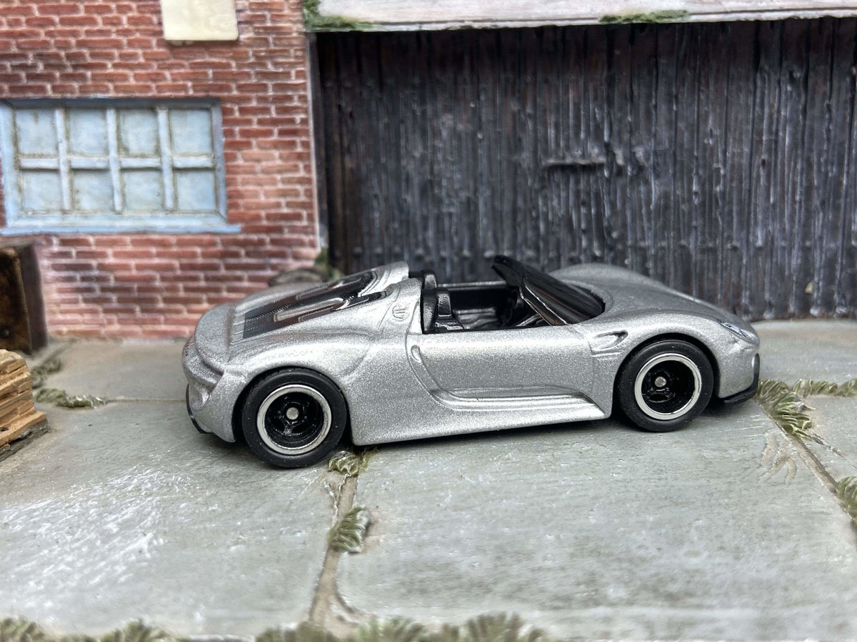 Silver Porsche 918 Spyder custom Hot Wheels with black and chrome wheels, view 1