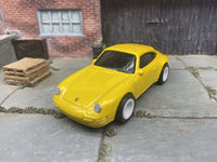 Porsche Carrera custom Hot Wheels, yellow with white wheels, view 4