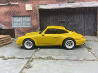 Porsche Carrera custom Hot Wheels, yellow with white wheels, view 3