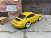 Porsche Carrera custom Hot Wheels, yellow with white wheels, view 2