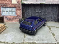Blue and black VW Golf MK2 custom Hot Wheels with black and chrome wheels, view 3