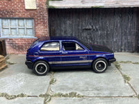 Blue and black VW Golf MK2 custom Hot Wheels with black and chrome wheels, view 4