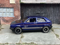 Blue and black VW Golf MK2 custom Hot Wheels with black and chrome wheels, view 1
