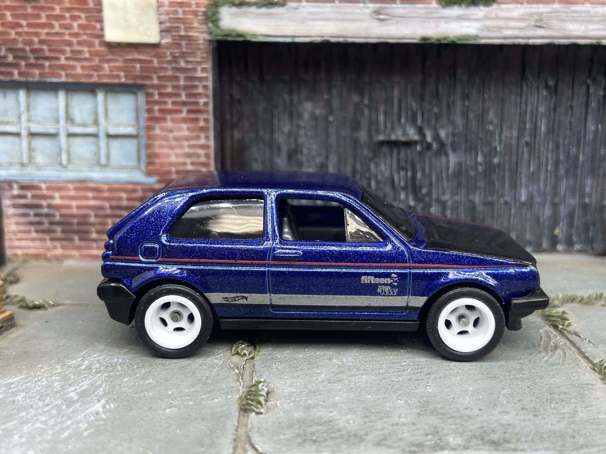 Blue and black VW Golf MK2 custom Hot Wheels with white wheels, view 1