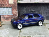 Blue and black VW Golf MK2 custom Hot Wheels with white wheels, view 3