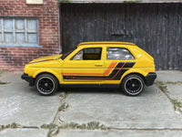Yellow black and orange VW Golf MK2 custom Hot Wheels, view 1