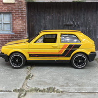 Custom Hot Wheels VW Volkswagen Golf MK2 In Yellow, Black and Orange With Black and Chrome 6 Spoke Studded Wheels and Rubber Tires