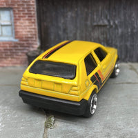 Custom Hot Wheels VW Volkswagen Golf MK2 In Yellow, Black and Orange With Black and Chrome 6 Spoke Studded Wheels and Rubber Tires